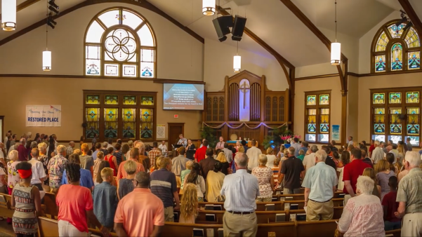 Christians worshiping inside First Christian Reformed Church in Grand Rapids.